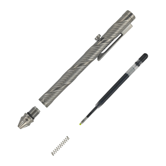 Whorl pen with the front tip assembly removed, beside an ink refill and spring