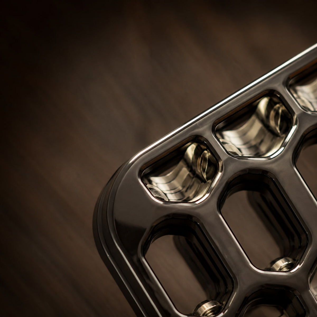 Detail of the outer edge and rows of cutouts on the Arca open-frame slider.