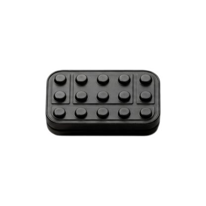 Front view of the Brix fidget slider showing rows of raised studs and rectangular outlines.