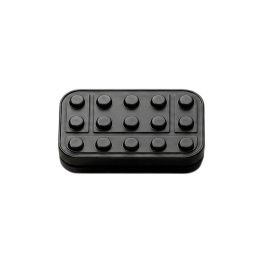 Front view of the Brix fidget slider showing rows of raised studs and rectangular outlines.