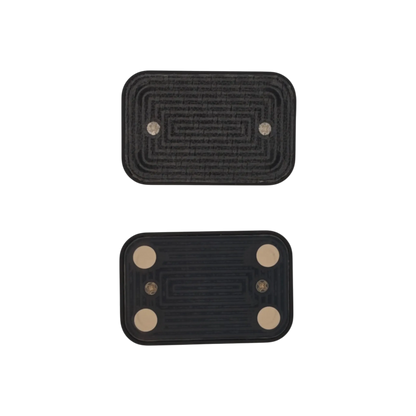 Two separated Brix slider plates on a plain background, with patterned sliding faces and four pale corner pads on the lower plate.