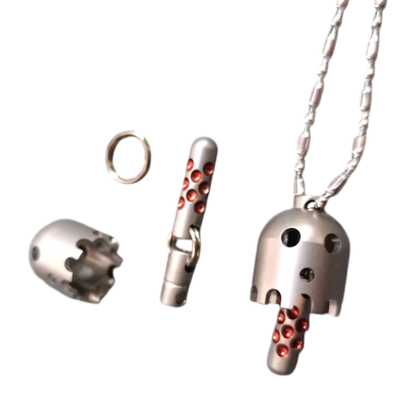 Daze bell pendant on a chain beside a separate shell, connecting rods, and ring.