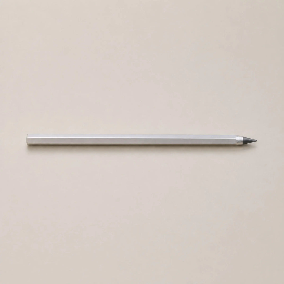 Side view of the Facet pencil lying horizontally on a light background