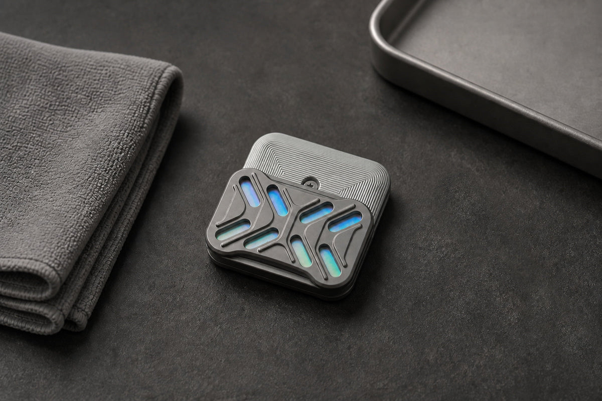 Gleam magnetic slider angled on a dark desk beside a tray.
