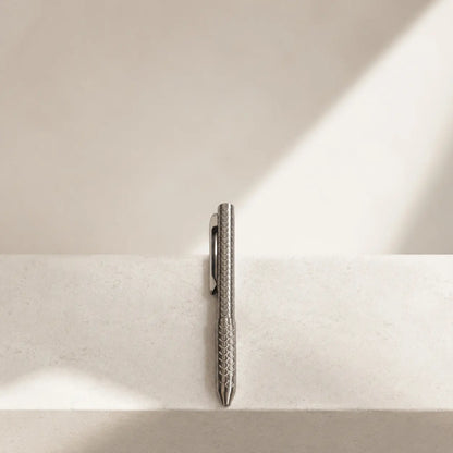 Imbra EDC pen arranged vertically on a pale stone ledge